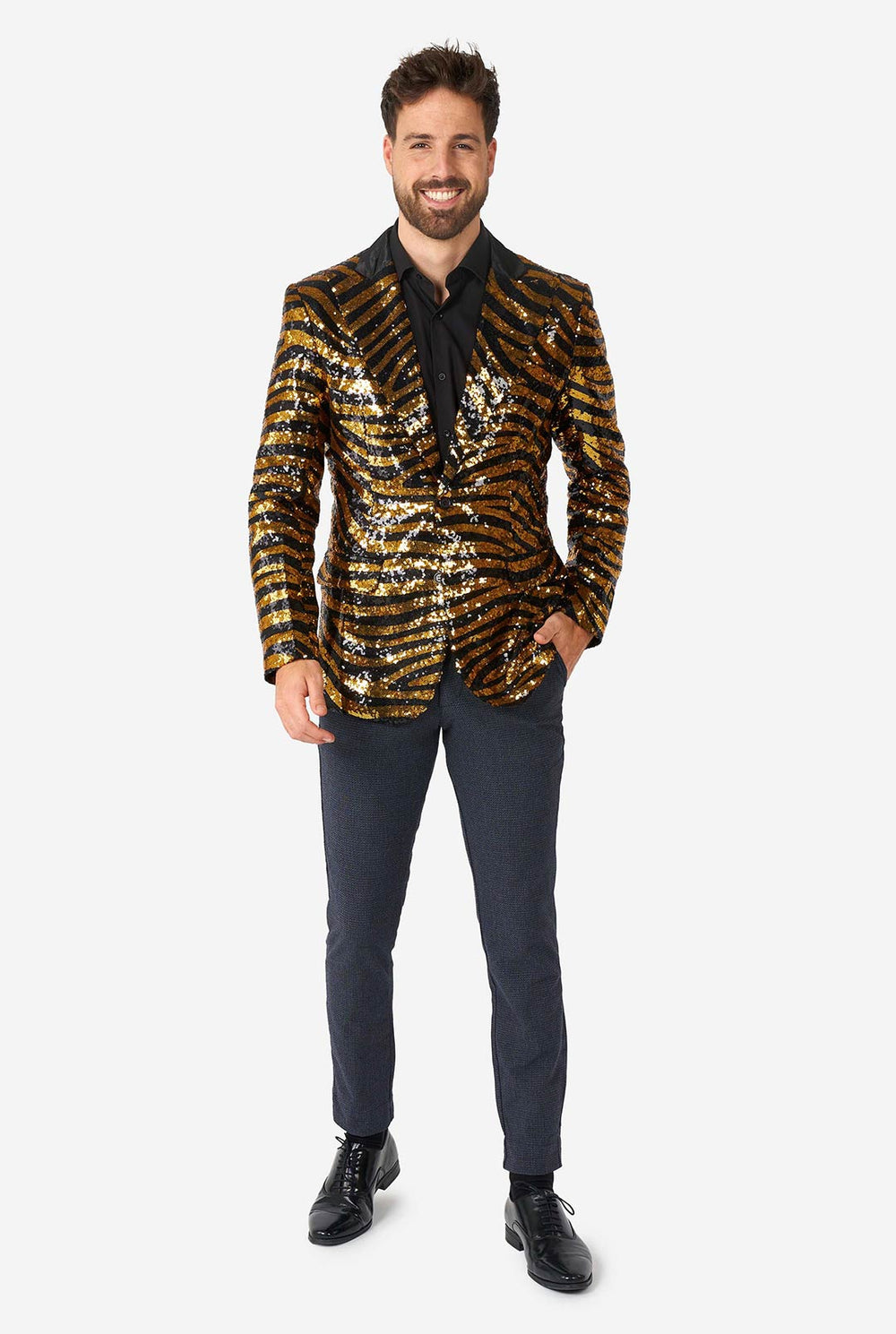 Man wearing a gold and black sequin jacket on a white background