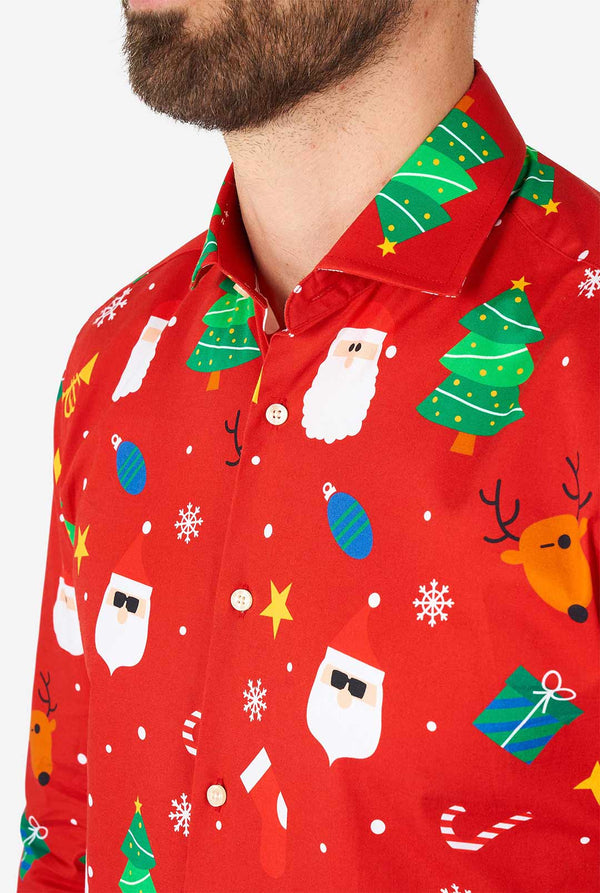Man wearing red Christmas dress shirt with Christmas icons
