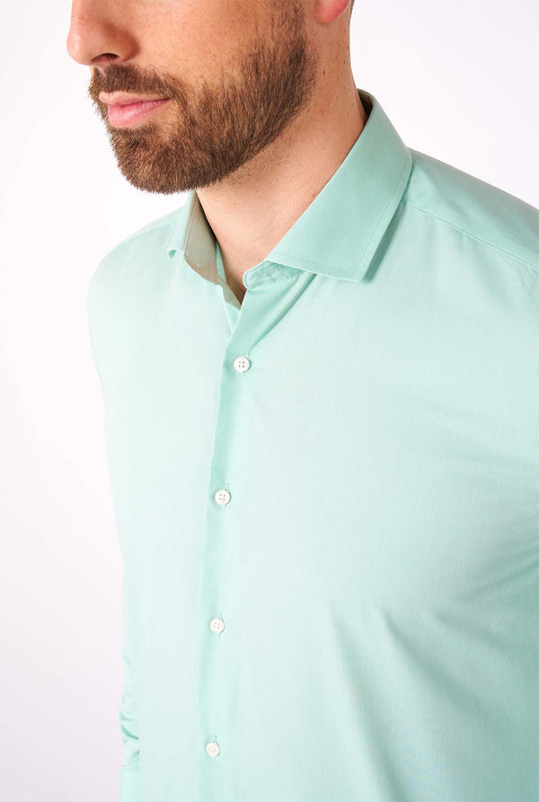 Man wearing mint green dress shirt