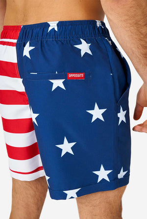 Man wearing summer outfit, consisting of shirt and shorts, with USA flag print