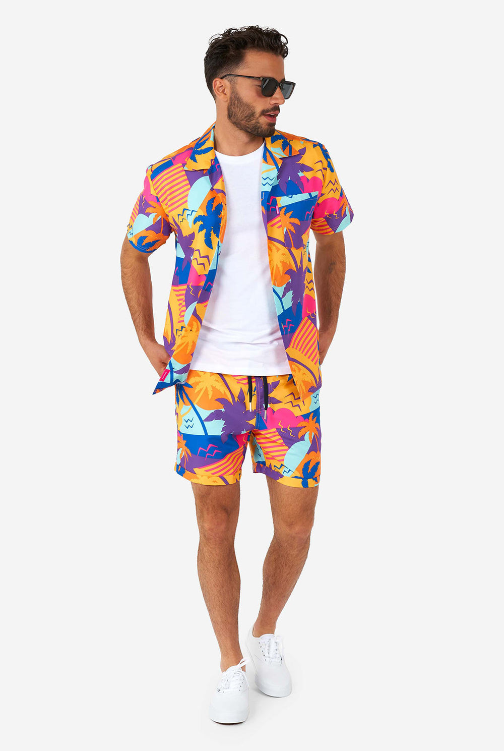 Man wearing colorful summer shorts and shirt