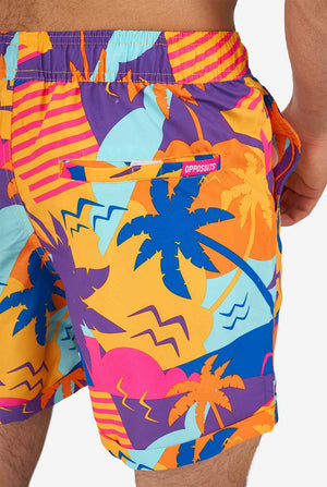 Man wearing colorful summer shorts and shirt