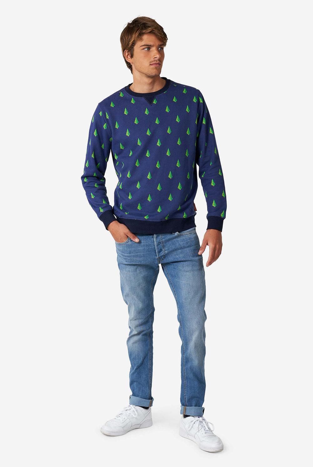 Man wearing blue Christmas sweater with Christmas tree print