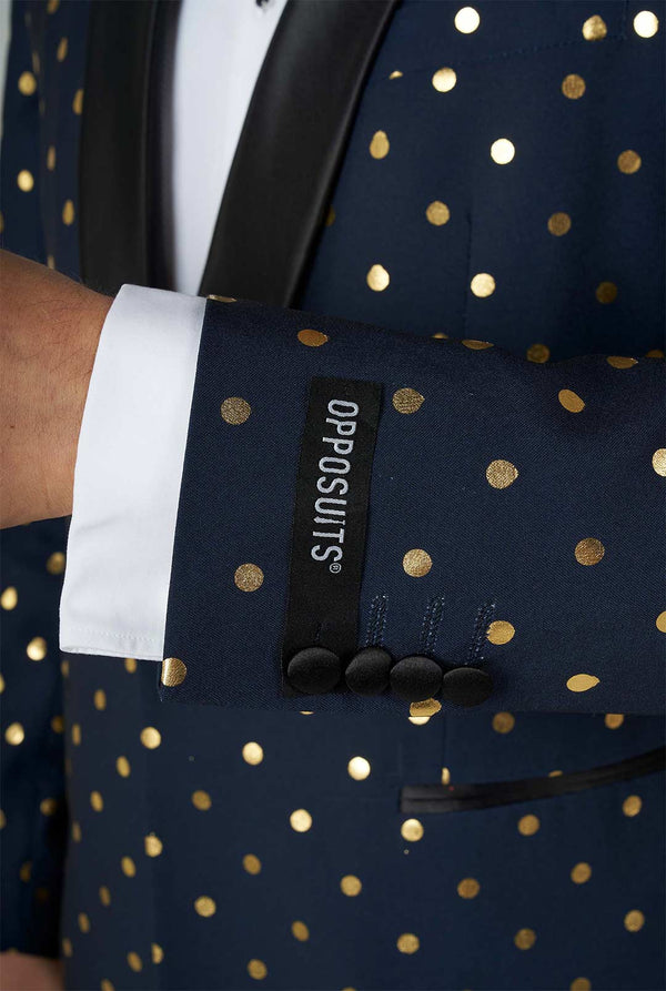 Man wearing blue tuxedo with golden dots