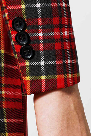 Woman wearing red tartan Christmas suit