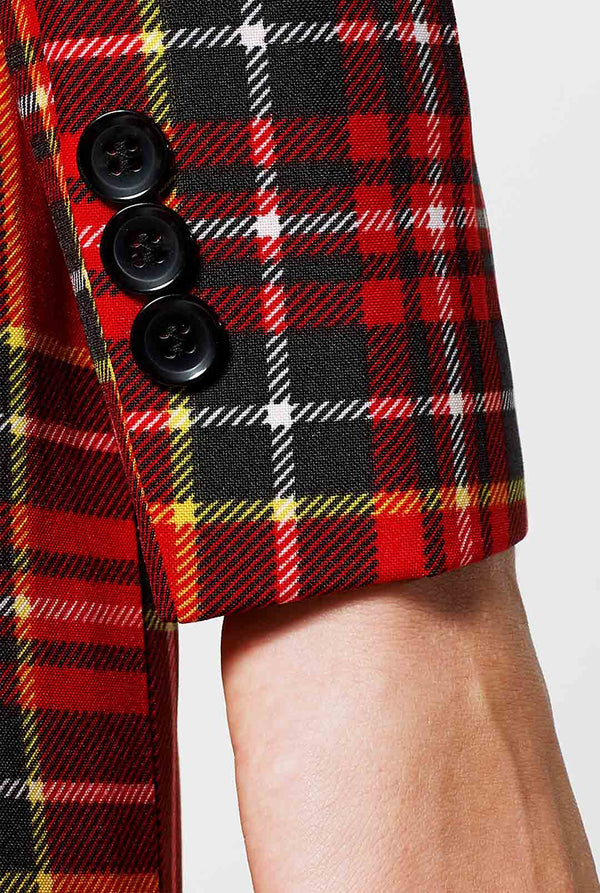 Woman wearing red tartan Christmas suit