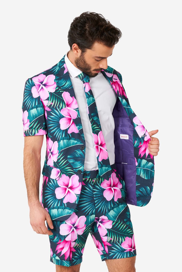 Man wearing blue summer suit with pink flowers in Hawaiian print